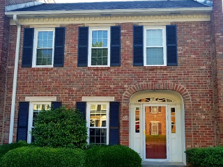 new windows and door on brick house